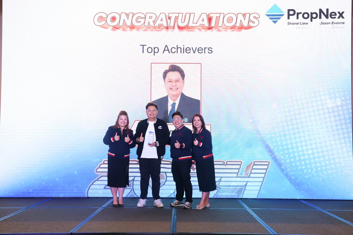 The team on the PropNex Top Achievers stage.